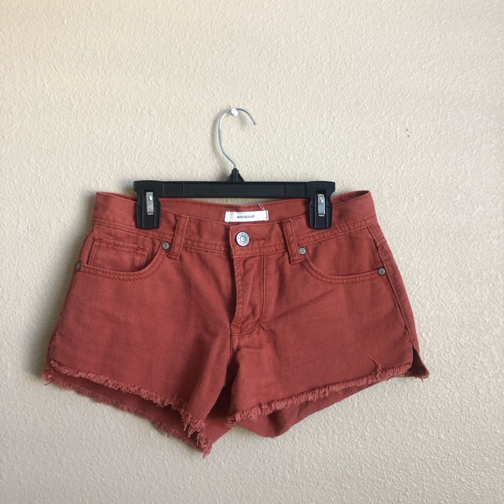 rust colored low rise denim shorts
